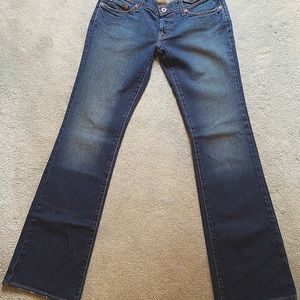 Women’s extra long Lucky brand dark denim flared jeans (Approximate size 8/10)